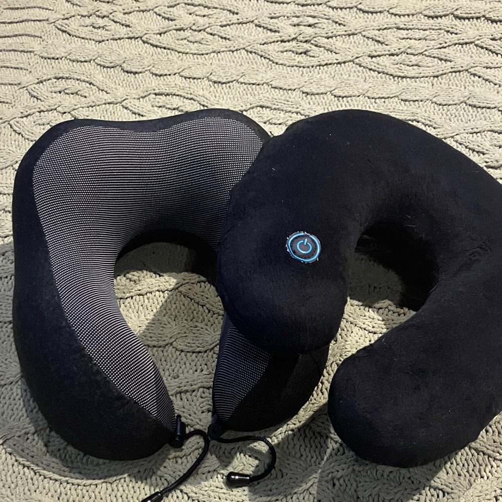 2 Black Travel Neck Pillows one with Blue tooth one is very thick
